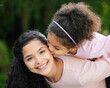 © peopleimages.com - Mother, girl and bonding in portrait with piggyback for development, support and together. Daughter, woman and playful with kiss on cheek, growth and love as happy, kid and family for fun in outdoor