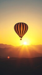 Wall Mural - hot air balloon floating above serene landscape during stunning sunset with warm colors in the sky a