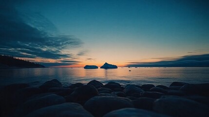 Aufkleber - A calm arctic location features a massive iceberg and smooth rocks in the foreground as soft light creates a serene atmosphere during twilight hours