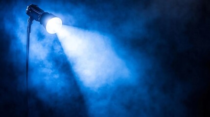 Aufkleber - A dramatic low-angle view captures a single spotlight casting a vibrant beam through smoky surroundings, creating an atmosphere filled with color and depth