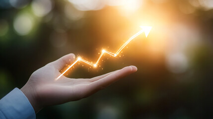 Poster - Hand holding a glowing upward trend line with blurred background suggesting growth and opportunity