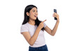© Sewupari Studio - Happy young Asian woman taking a selfie and pointing at her smartphone, isolated on transparent background