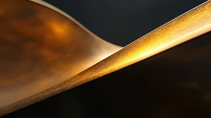 Aufkleber - This close-up of a wave-like sculpture showcases its elegant curves and golden hues. Ideal for art enthusiasts, designers, and anyone appreciating fine craftsmanship. AI