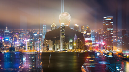 Aufkleber - A businessman in a suit gazes at the Hong Kong skyline at night.  A double exposure creates a layered effect of the city and the figure.