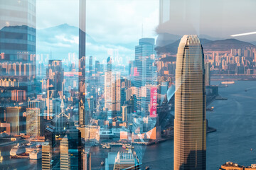 Fototapete - Double exposure cityscape of Hong Kong features layered skyscrapers and harbor view. Urban scene with blended buildings and water creates a unique perspective.