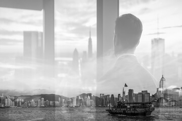 Poster - A monochrome double exposure blends a person looking out a window with a Hong Kong cityscape, featuring skyscrapers and a boat on the water.