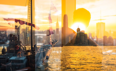 Poster - A double exposure image blends a junk boat sailing in Hong Kong harbor with a cityscape at sunset. Golden light bathes the scene, creating a warm and layered urban waterscape.
