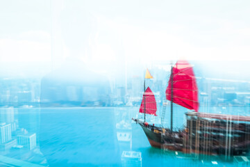 Aufkleber - Hong Kong harbor scene with a junk boat featuring iconic red sails. A double exposure effect merges the boat with the city and water.