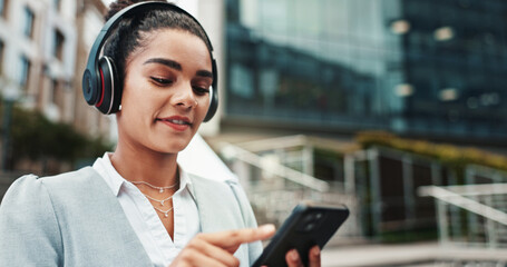 Poster - Business woman, headphones and phone in city with commute, music and streaming sound on web. Person, smartphone and travel in town with audio, subscription and search for song on trip in Colombia