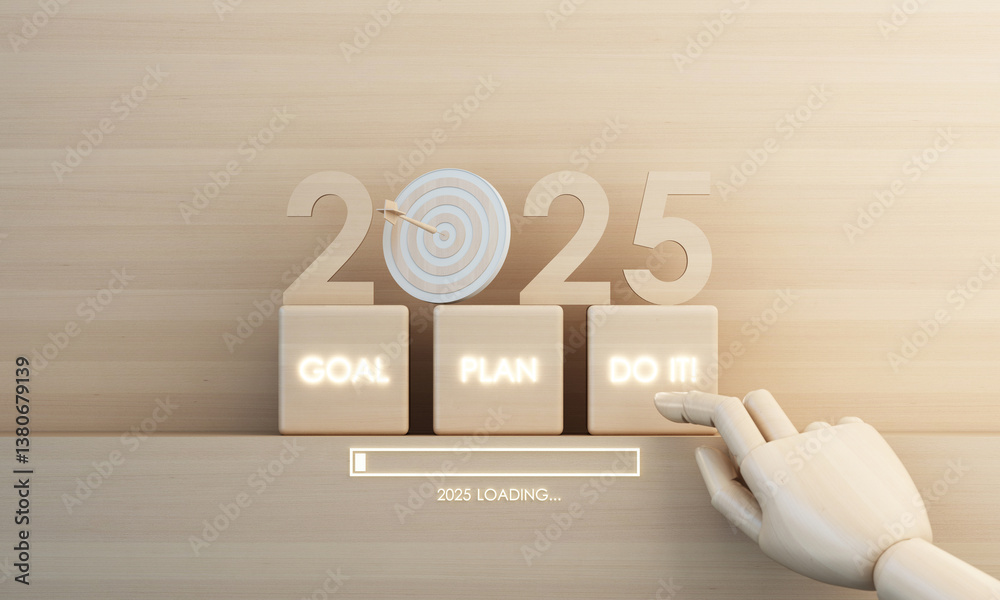 Wooden blocks display 2025 with goal, plan and action prompts. A finger ...