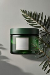 Poster - green glass jar with a blank label surrounded by leaves on a minimalist background