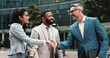 © peopleimages.com - Outdoor, business people and smile with handshake for welcome, greeting or agreement for realtors. City, clients and real estate agent with shaking hands for introduction, deal success or partnership