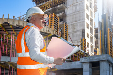 Poster - man builder. architect at construction site. builder with tablet computer and papers. man inspector 