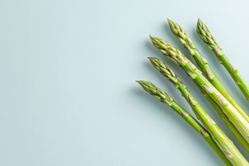 Poster - minimalist close-up of asparagus spears placed diagonally surrounded by soft natural lighting and ample copy space