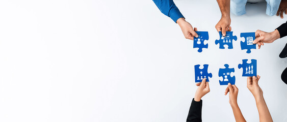 Poster - A dynamic scene showcasing diverse hands working together to assemble blue puzzle pieces, symbolizing teamwork and collaborative problem-solving in a creative environment. Amity