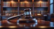 © DigitalDruid - Legal office of attorneys, justice and law theme. A judge's gavel or hammer and base used by a judicial figure on a desk in a courtroom with blurred legal books and a bookshelf in the background.