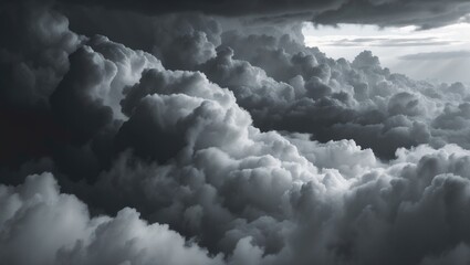 Fototapete - dark dramatic sky with black stormy clouds prior to rainfall or snowfall as an abstract backdrop, extreme weather, high contrast image