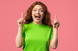 © kohanova1991 - Breakthrough genius idea. Happy woman eureka moment, pointing finger up on pink