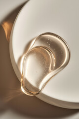 Poster - Elegant Clear Gel Droplets with Bubbles Gliding on Smooth White Surface in Soft Natural Light