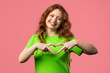 © kohanova1991 - Smiling woman showing sign of shape heart. Positive lady on pink. Love. health