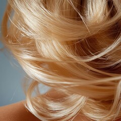Poster - Close up of light blonde hair styled up with soft waves against a blurred blue background