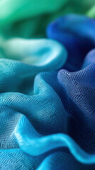 Poster - A blue and green fabric with a wavy texture. The colors are vibrant and the fabric appears to be made of a synthetic material