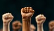 © Aofintarapak - Fists raised in solidarity at a protest rally diverse group of fighting for equality and justice dynamic energy of a social movement strong sense of community and rebellion. United