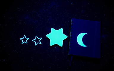 Wall Mural - glowing star and crescent moon shapes emit a neon blue light against a dark backdrop reminiscent of 