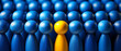 © Alberto Masnovo - Closeup of one single yellow human shape (wooden figurine) among a large group of blue ones. Standing out from the crowd, thinking outside the box, leadership and individuality concept. Generative Ai.