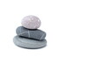 © Снежана Кудрявцева - Against a white background stands a tower made of turned sea stones.
