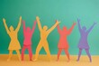 © Imagentive - Diverse Happy Figures Cutouts Hands Raised Friendship