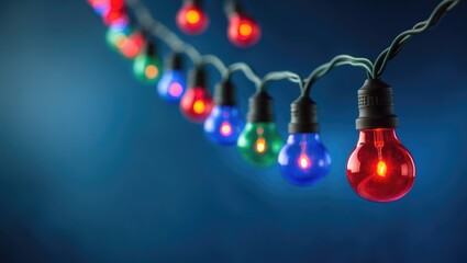 Poster - Christmas lights string against a background with space for text.