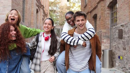 Fototapete - Diverse group of happy high school students posing outdoors, smiling and enjoying time together, showcasing friendship, youth and positivity. Teenage people giving a piggyback ride to their classmates