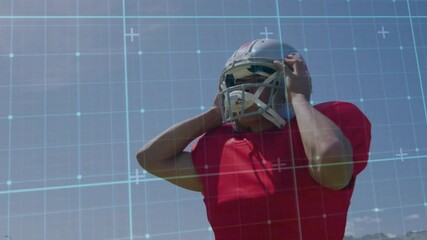 Poster - Adjusting helmet, football player with digital grid overlay animation in background