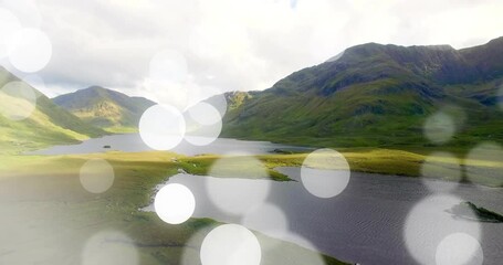 Poster - Animation of abstract circular light patterns over scenic mountain landscape with lake