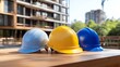 © santima - Construction helmets on a wooden table display.