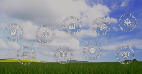 Poster - Animation of icons overlaying grassy landscape with blue sky in background