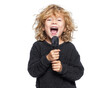 © Alice a. - joyful child with curly blonde hair passionately sings into microphone, expressing excitement and enthusiasm. vibrant energy captures essence of fun performance