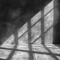Poster - Dramatic light and shadow play on a textured gray wall with wooden floor in an empty room creating a moody atmosphere and an architectural design element