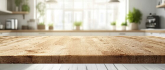 Poster - Serene kitchen interior with natural light illuminating a wooden countertop and blurred background showcasing modern appliances and potted plants
