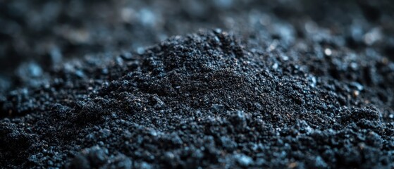 Poster - Close up of dark charcoal powder pile with a shallow depth of field for artistic effect and industrial applications like fuel and filtration