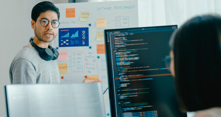 Group adult Asia male female software developers mentor leader manager talk strategy plan to executive write prompt AI bot IT app program nomad, video game, data center. Whiteboard slideshow code.