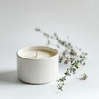 © Bunthy Studio - Aromatherapy Candle with Elegant Floral Fragrance on White Background