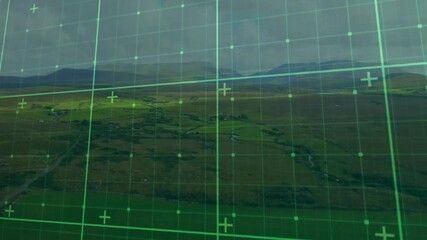 Poster - Green grid overlay animation over aerial view of expansive landscape