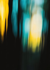 Wall Mural - A blurry image of trees with a yellow and blue background