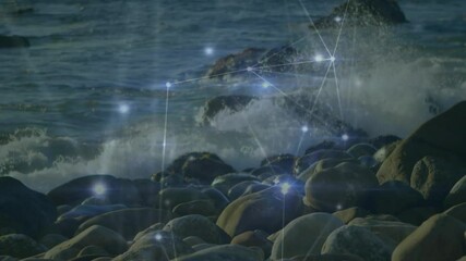Poster - Waves crashing on rocky shore with digital network connections overlay animation