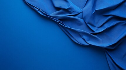 Poster - Elegant blue fabric flowing over blue background forming copy space