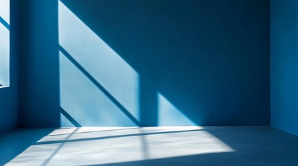 Poster - Sunlight casting geometric shadows in empty room with blue walls