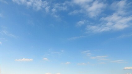 Wall Mural - light blue vault of heaven, filmy clouds wandering. the light blue sky is pure and vast. a few filmy