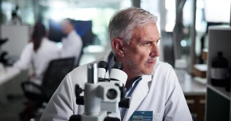 Poster - Scientist, man and microscope at laboratory with research, test and review for sample in pharmaceutical study. Mature person, process and insight for medical trial, perspective or vaccine development